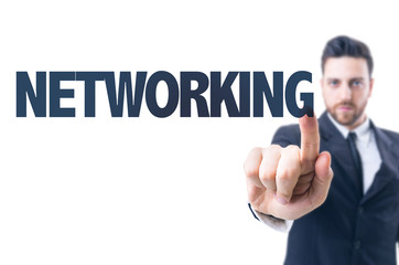 Business man pointing the text: Networking
