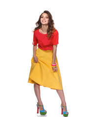 Beautiful woman with curly hair wearing a red jacket, isolated