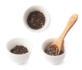 Cup filled with black peppercorn