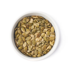 White cup filled with pumpkin seeds