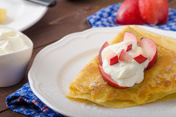 Cream pancakes with nectarines