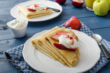 Cream pancakes with nectarines