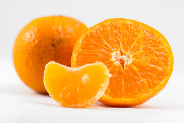 Orange half saw the watery orange juice. The fruit is refreshing