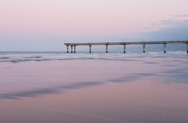 Sunset an the ocean shore, New Zealand