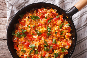 Omelette with vegetables in a pan close-up. top view horizontal
