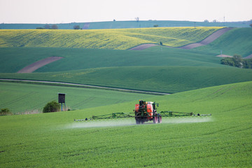 Tractor spraying fields