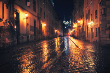 Retro style photo of old European city at night - 87749810