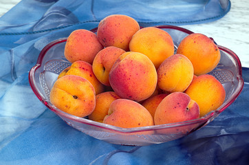 Ripe peaches in a bowl on the table