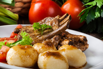 Pork spareribs served with silesian noodles and sauce