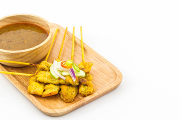 Grilled pork satay with peanut sauce.