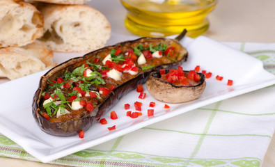 eggplant baked with vegetables and mushrooms, close-up