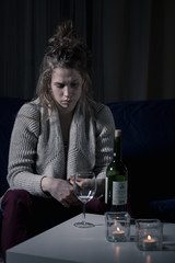 Alcoholic woman at night