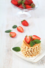 Waffles and ripe strawberries.