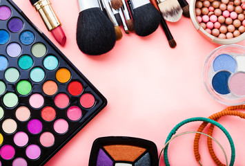 Cosmetics on pink background. Top view