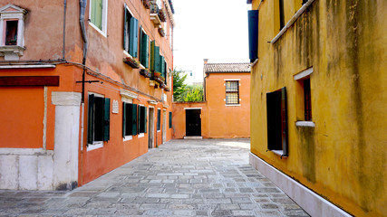 Alleyway with ancient building yellow and orange