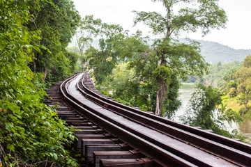 Obraz premium Conventional tracks through forest and mountains.