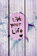 live your life tag style on wall