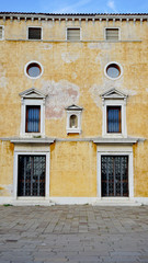 Fototapeta na wymiar ancient building with windows and doors