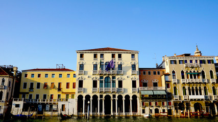 Fototapeta na wymiar ancient buildings piers and gondola in Venice