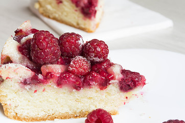 Homemade raspberry tart close-up. slices of cake with raspberry