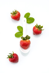 fresh strawberry in white spoon, healthy, natural, mint