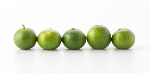 green lemon isolated on white background