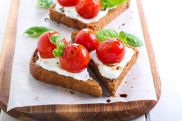 Open-face tomato and cheese bruschetta
