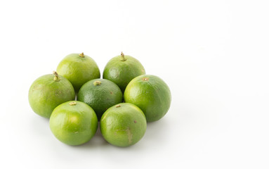 green lemon isolated on white background