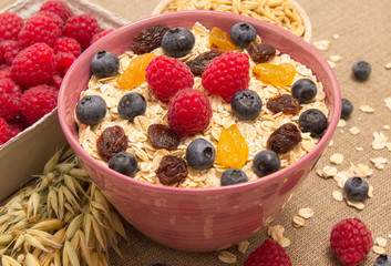 Healthy porridge with fruits on canvas