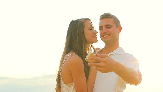 Young Happy Couple Taking Selfie (Self Portrait) Outside At Beach