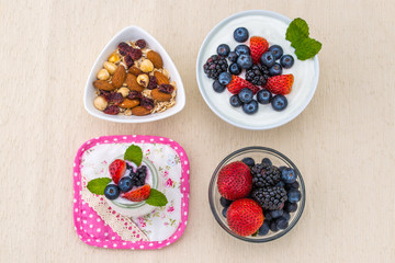 healthy breakfast with yogurt, berry and nuts, dieting