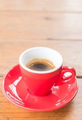 Obraz na płótnie Canvas Fresh brewed hot espresso in red cup