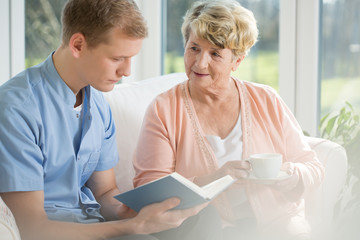 Older woman spending time with young man