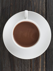a cup of chocolate on wood table