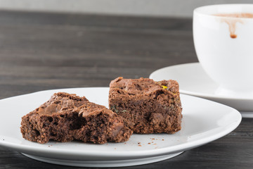 brownies in plate on wood table