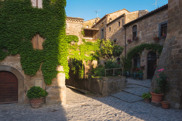 Long shadows of the old walls in the village Civita di Bagnoregi