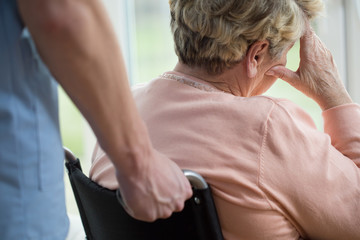 Sad woman on wheelchair