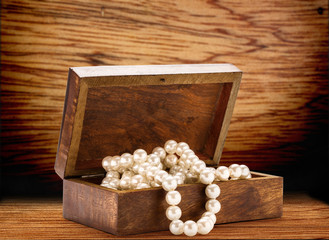 Wooden chest with white pearl necklace © Sergey Yarochkin