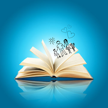 Open book with drawings on blue background