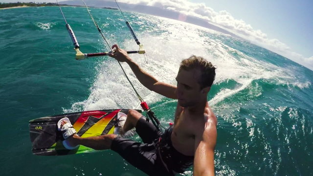 POV Shot of Kitesurfer Flying Over the Water in Hawaii. Extreme Summer Sports.