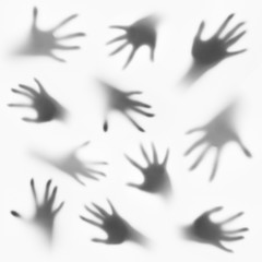 Collage of hands silhouettes behind glass foreground