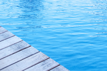 Wooden pier with blue sea background