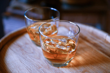 Glasses of brandy in cellar, close-up