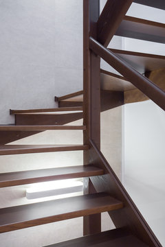 Wooden brown stairs in apartment
