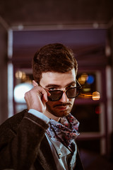 Young stylish sexy handsome model man in casual cloth lifestyle in glasses.