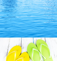 Colorful flip-flops on wooden boardwalk