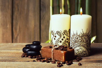 Beautiful spa composition with decorative Indian candles on wooden background