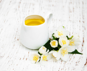 Fototapeta na wymiar essential oil with jasmine flower