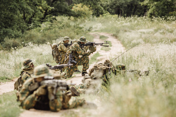 Group of soldiers special forces during the raid in the forest