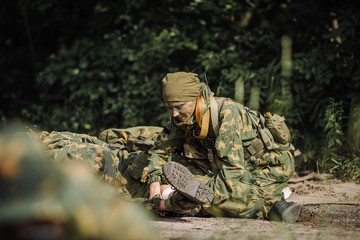 Fototapeta premium rangers team evacuate wounded comrade